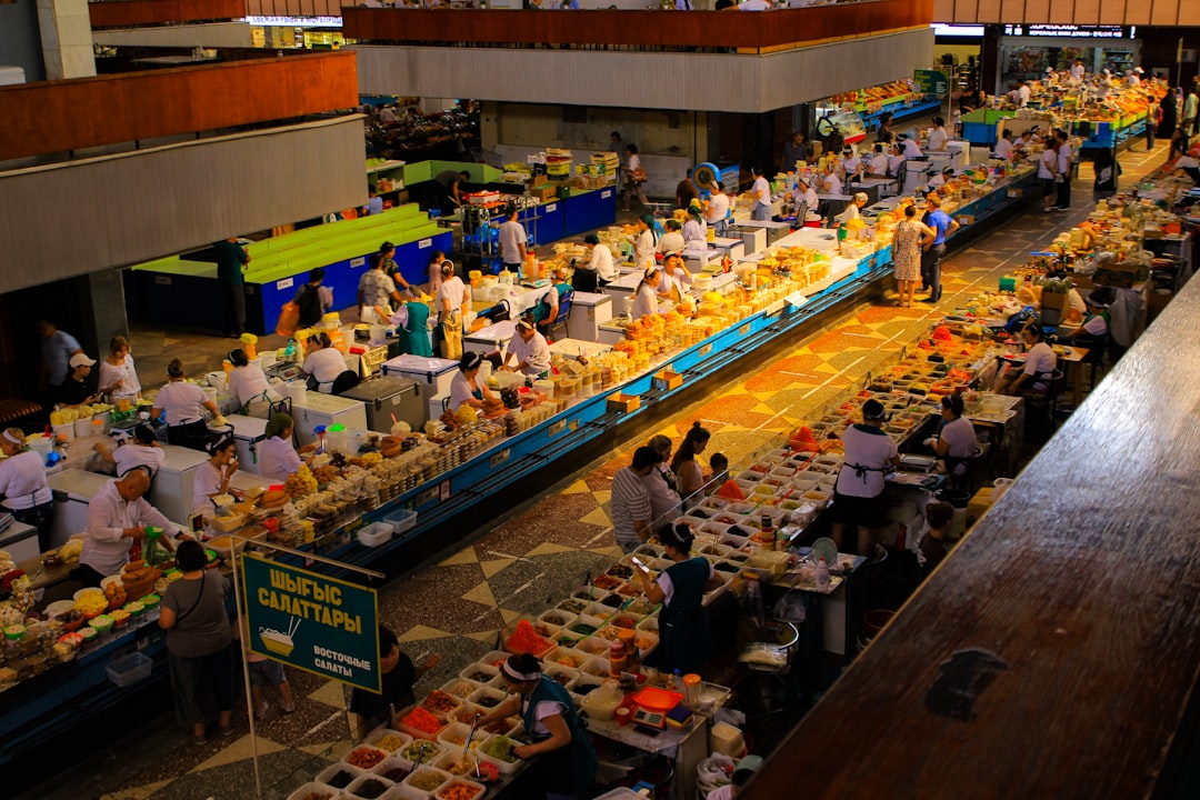 A busy market is filled with vendors and customers.
